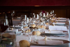 formal table setting with prominent clear wine glasses