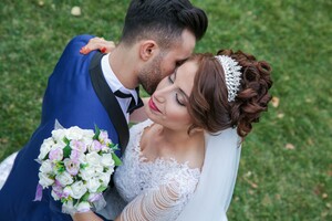 wedding couple embracing one another