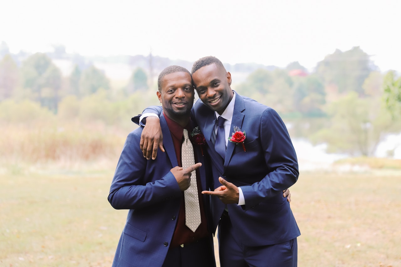 wedding groom posing with best man