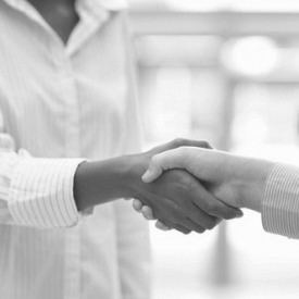 photo: two women shaking hands