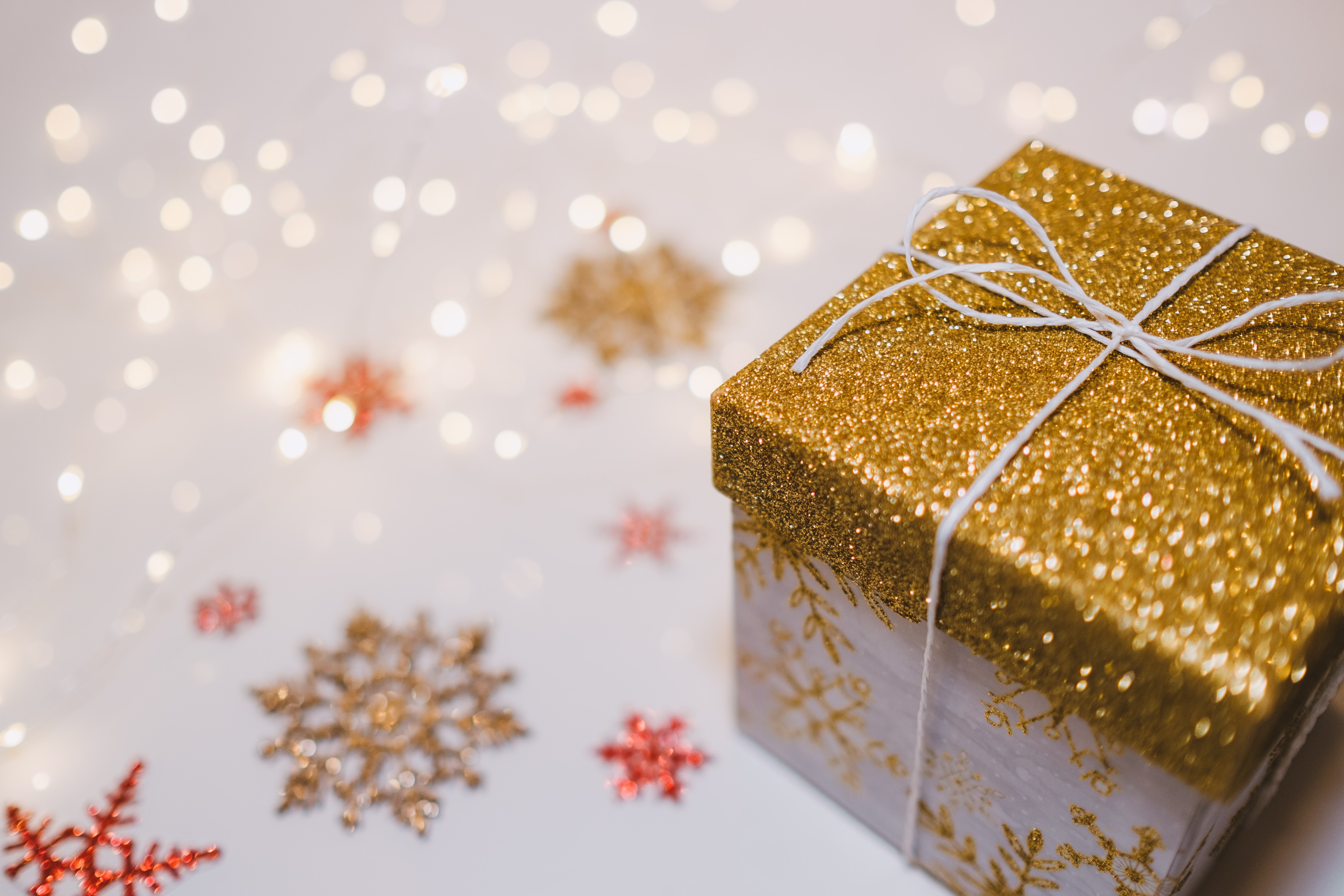 christmas gift box on a white table with snowflake stickers