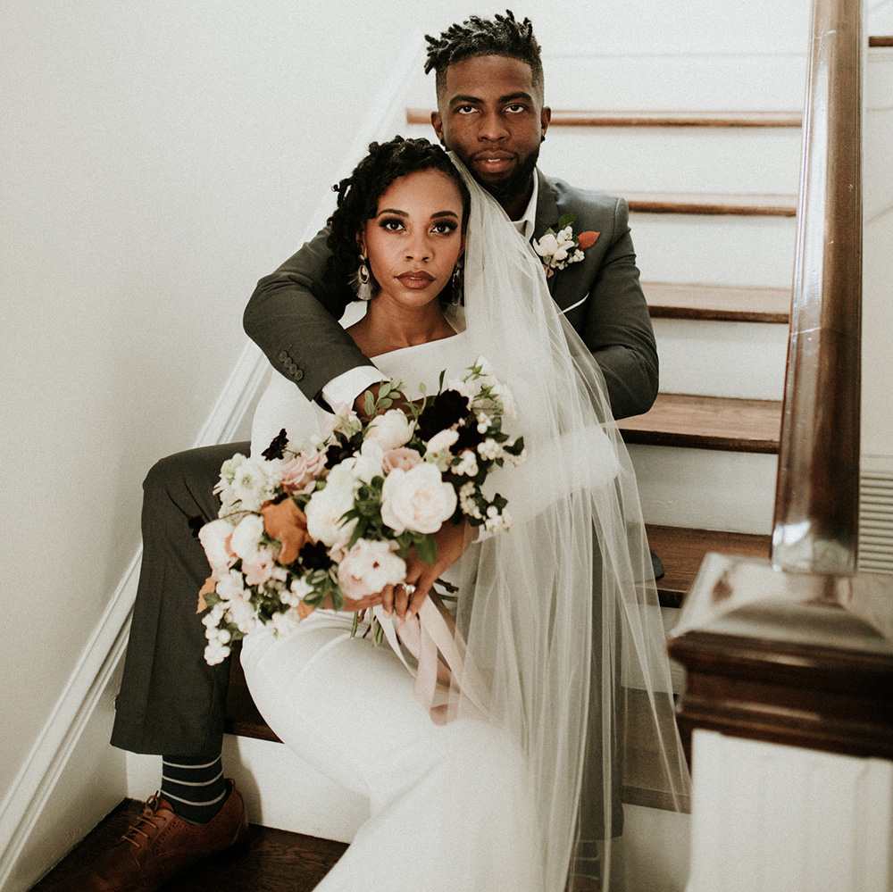 bride and groom embracing for a serious photo